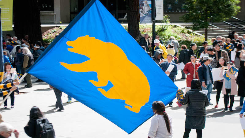 Crowd around cal bears flag